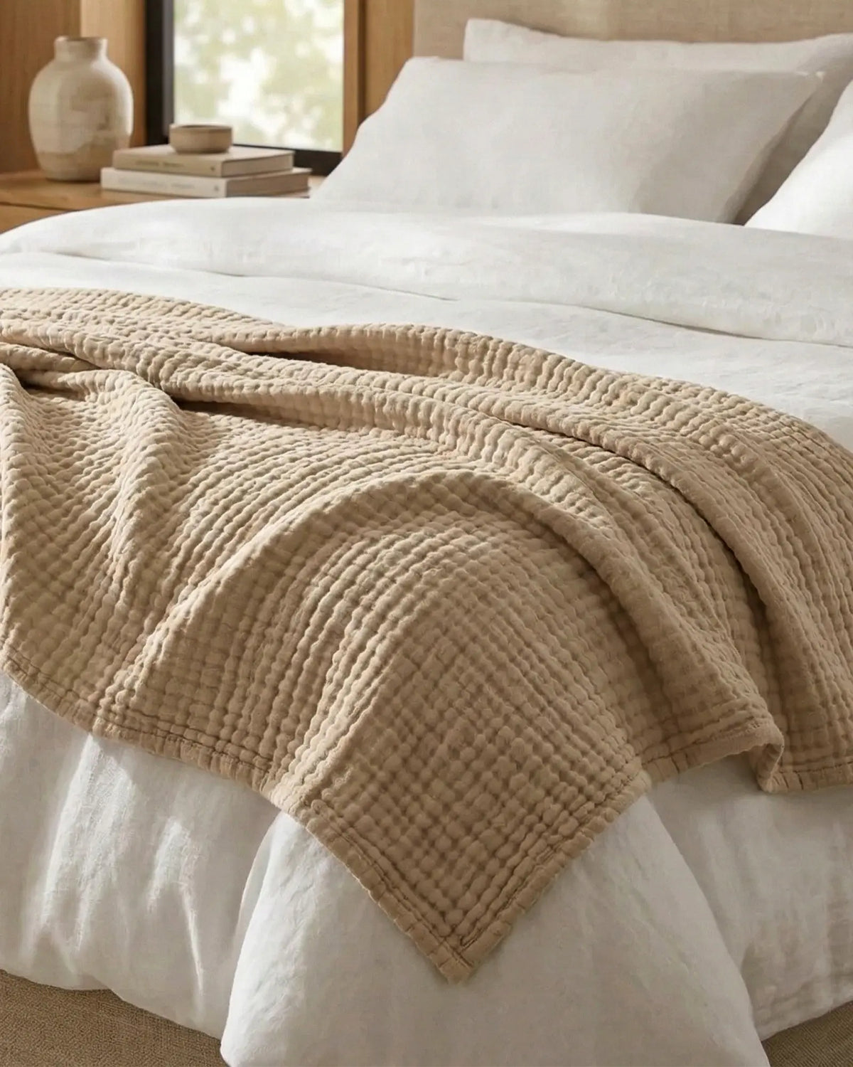 Muslin Blanket in Dune in a bedroom