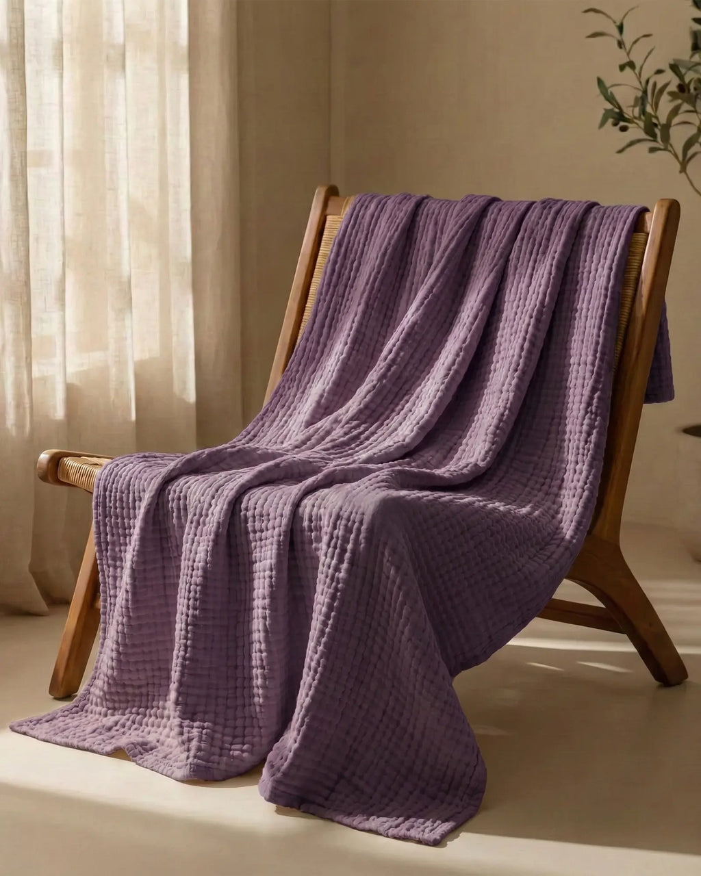 Muslin Blanket in Purple in a bedroom