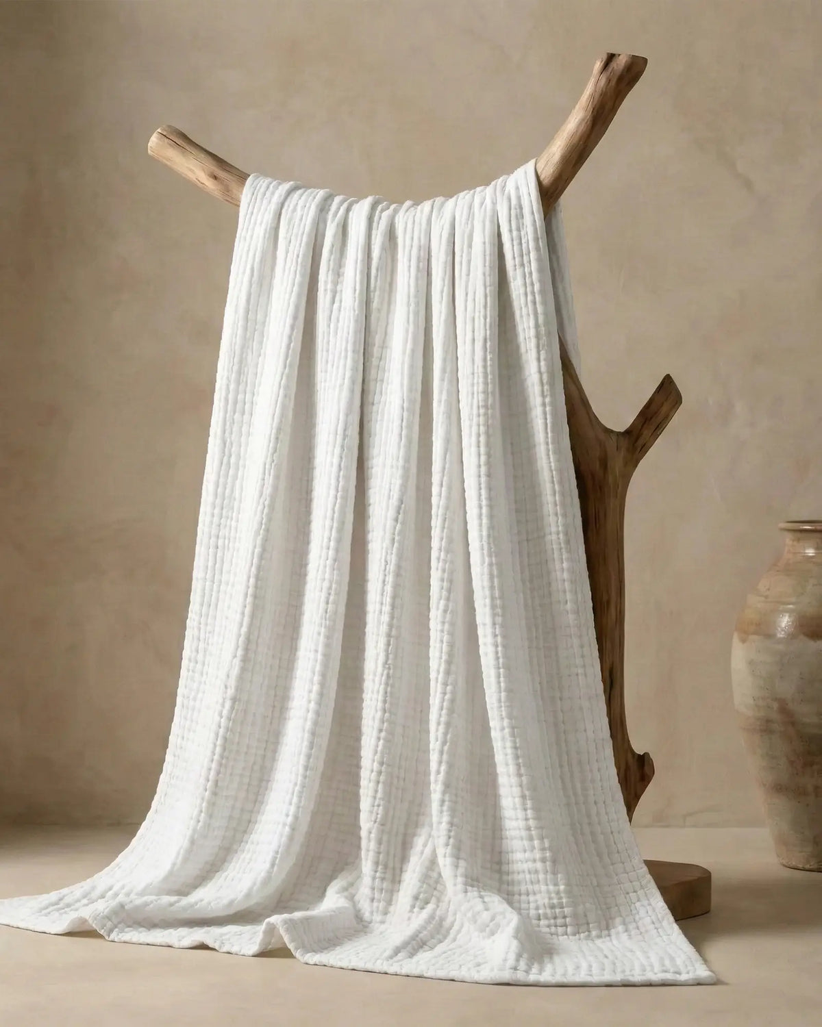Muslin Blanket in White, close-up of the open cotton weave