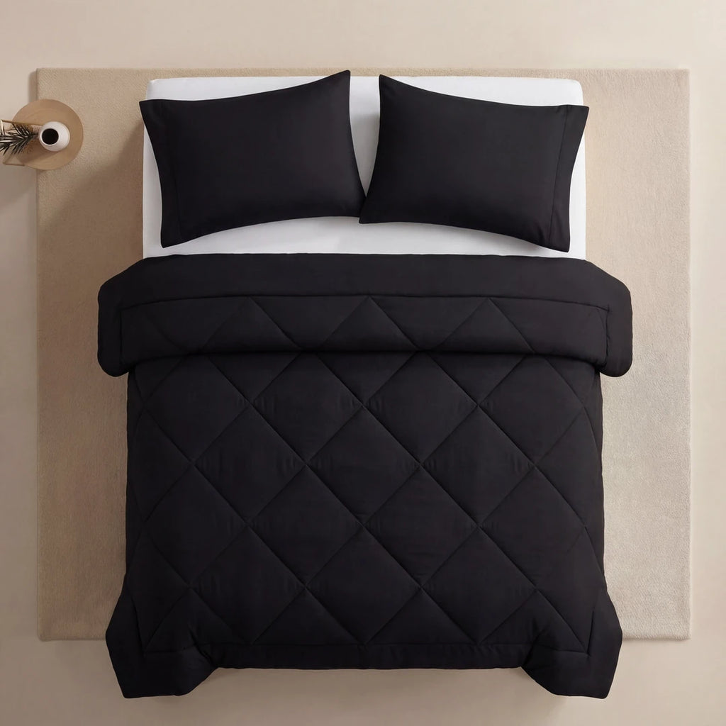 Nidora duvet in Midnight Black on a made bed