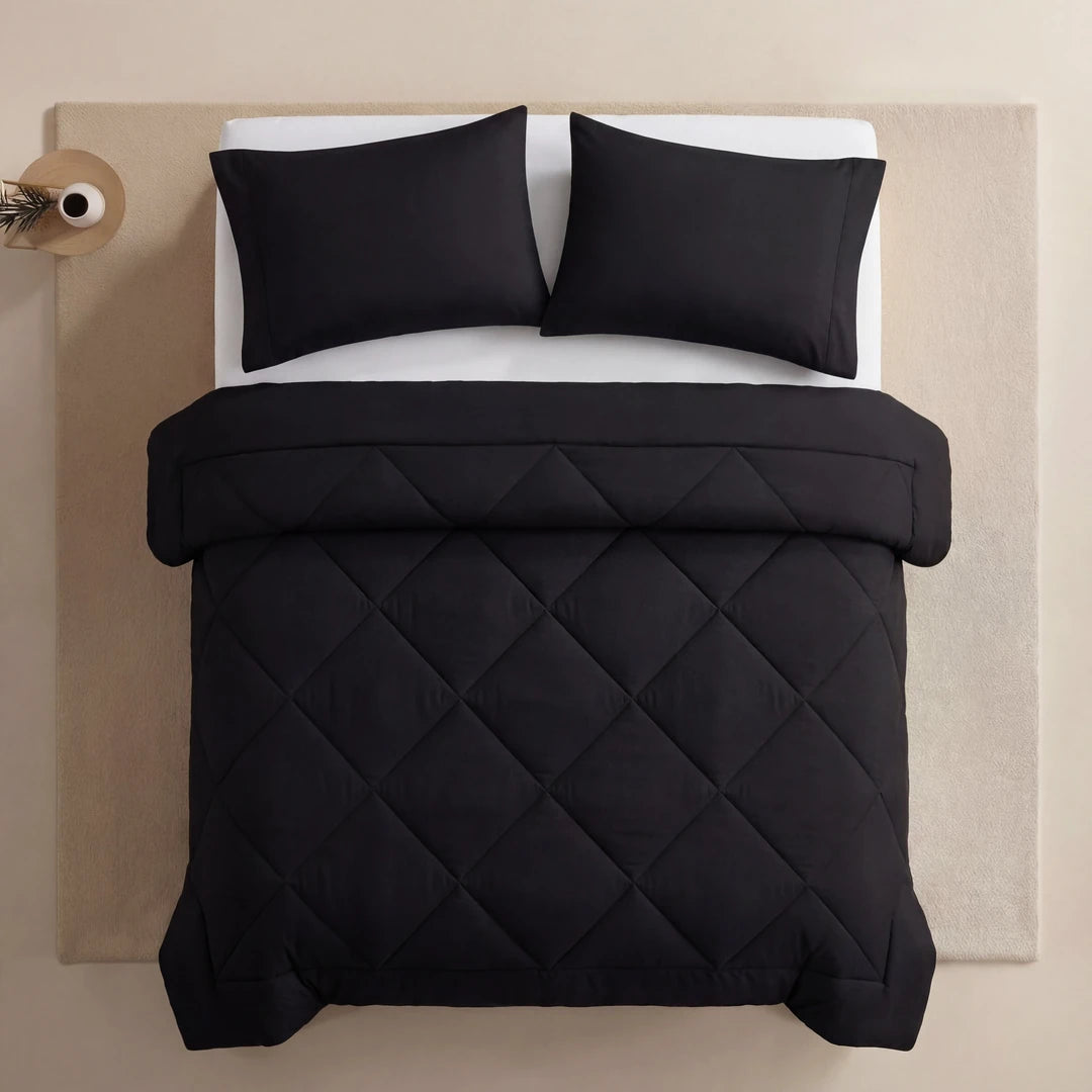 Nidora duvet in Midnight Black on a made bed