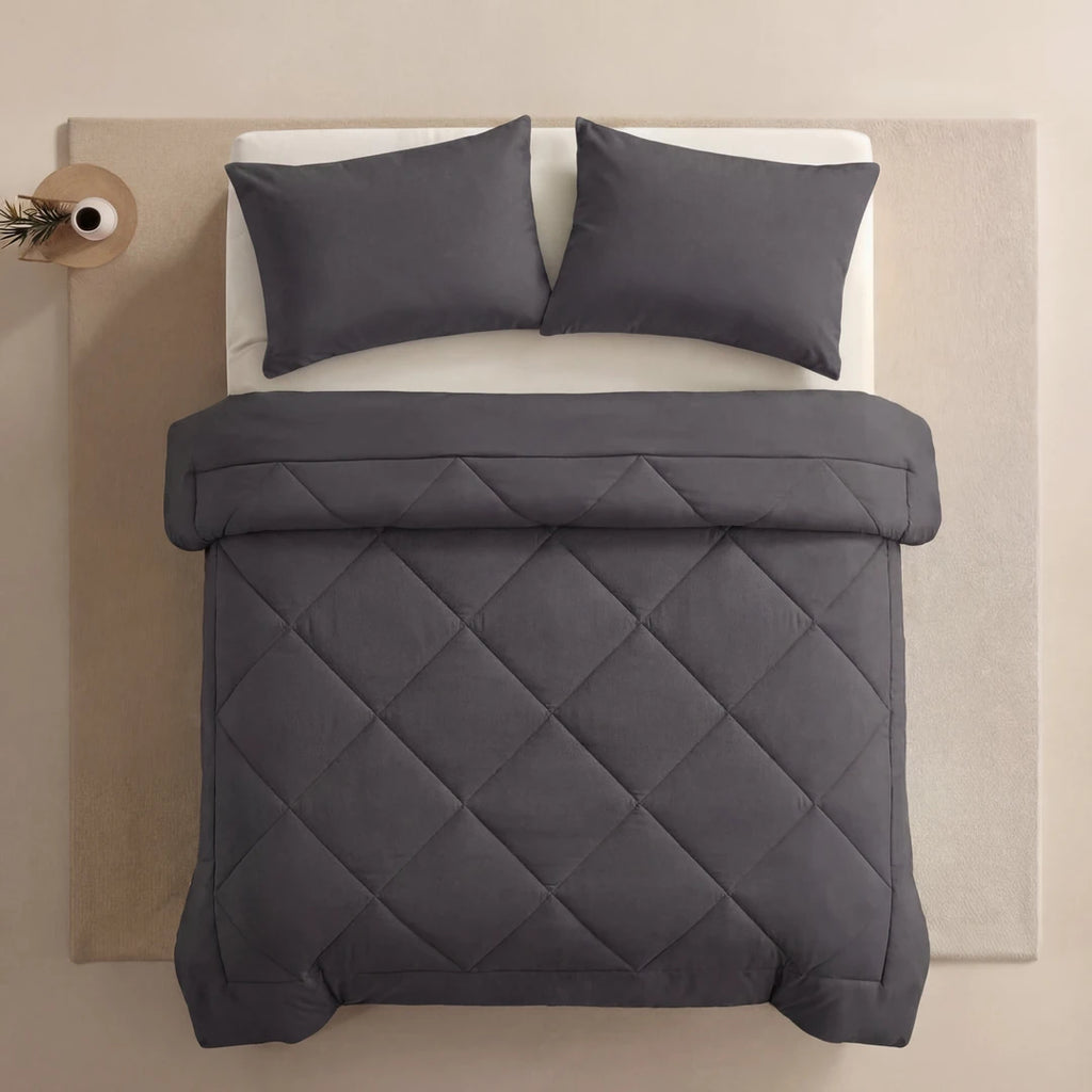Nidora duvet in Moonstone Grey on a made bed