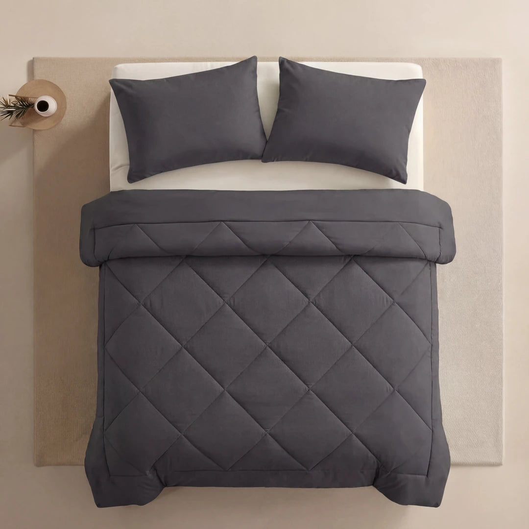 Nidora duvet in Moonstone Grey on a made bed